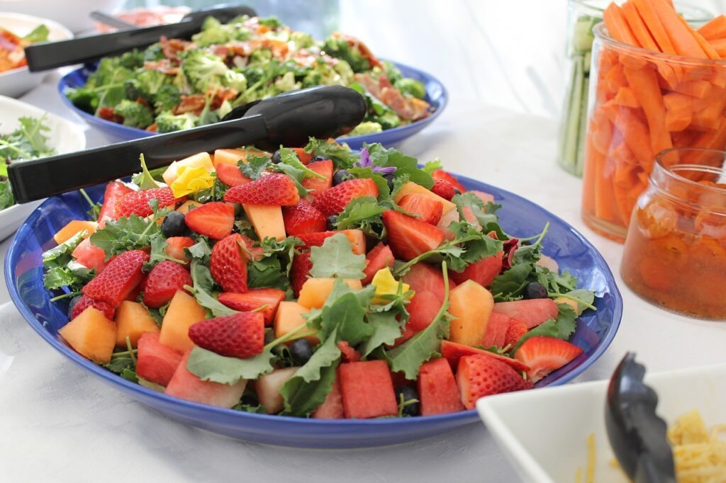 Fresh salads, vegetables and fruit ready to be served for healthy eating