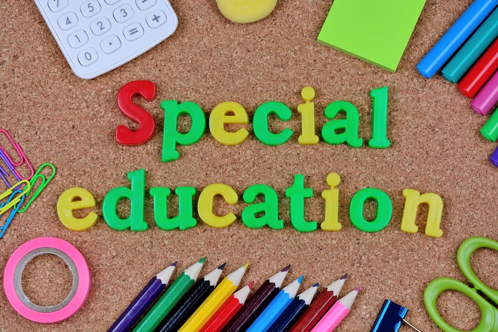 The words Special Education on cork background closeup